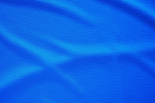 Maillot de football bleu vêtements tissu texture vêtements de sport fond vue de dessus en gros plan