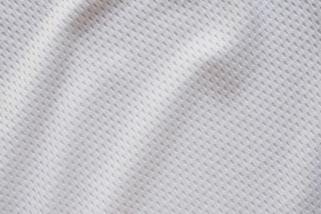 Maillot de football de vêtements de sport en tissu blanc avec fond de texture de maille d'air