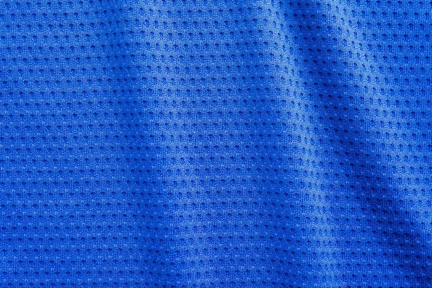 Maillot de football de vêtements de sport en tissu de couleur bleue avec fond de texture en maille d'air