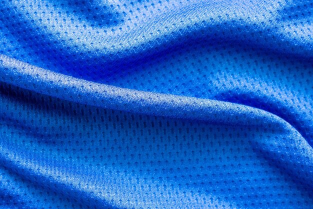 Maillot de football de vêtements de sport en tissu de couleur bleue avec fond de texture de maille d'air