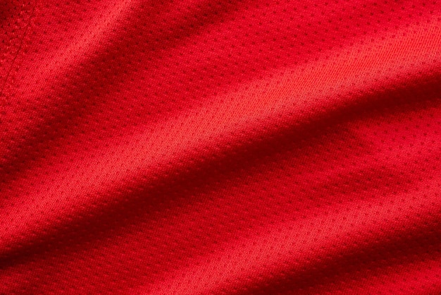 Maillot de football de vêtements de sport en tissu rouge avec fond de texture de maille d'air