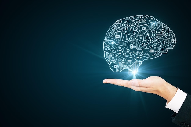 Main avec cerveau de circuit créatif sur fond bleu Concept d'intelligence artificielle et de matériel
