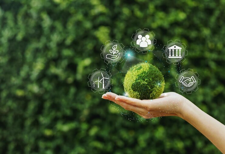 Main de fille tenant la terre verte pour l'environnement social et sur la connexion réseau sur la nature