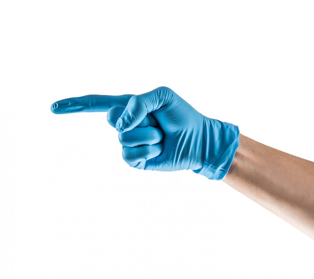 Main avec gant en latex bleu pointant vers la gauche