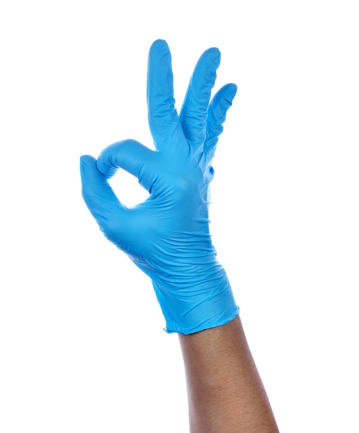 Main d&#39;un médecin portant des gants en latex bleus