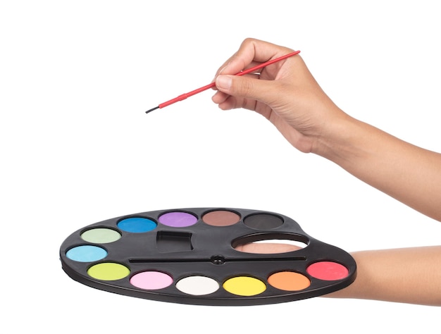 main tenant la palette de couleurs de l'eau pour la peinture isolé sur fond blanc
