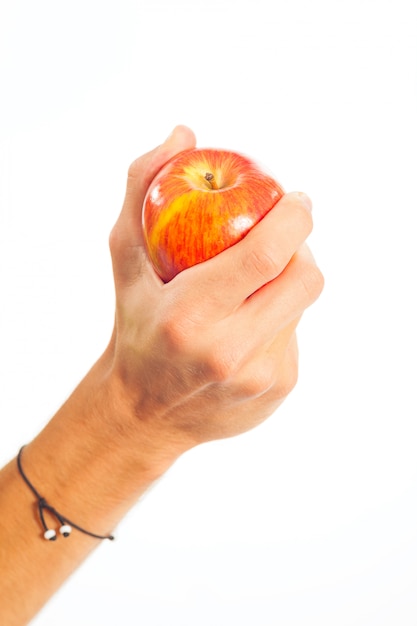 Main tenant une pomme