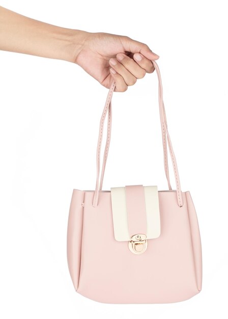 Photo main tenant le sac rose isolé sur fond blanc.