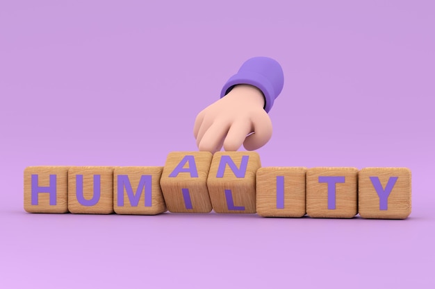 La main tourne les dés et change le mot humanité en humilité