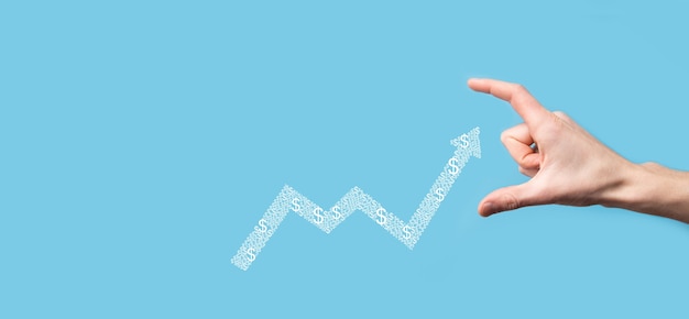 Maintenez le dessin sur le graphique croissant de l'écran, flèche de l'icône de croissance positive.pointant sur le graphique de l'entreprise créative avec des flèches vers le haut.