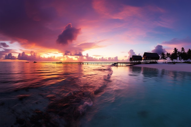 Photo les maldives au coucher du soleil un paradis de plage avec des cieux colorés des villas d'eau et de la tranquillité