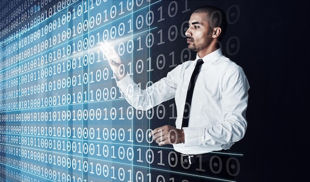 Man touch and hologram in office for coding software development or numbers at night Working late programmer or future technology in dark agency with interactive code innovation or cybersecurity