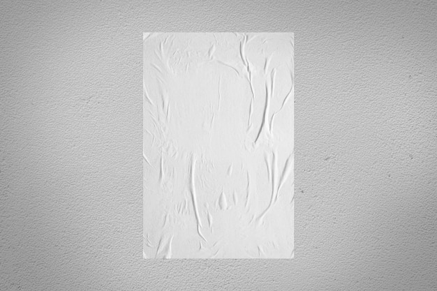 Maquette d'affiche en papier collé en pâte de blé blanche vierge sur fond de mur en béton