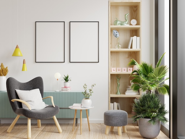 Maquette à deux affiches avec cadres verticaux sur un mur blanc vide à l'intérieur du salon et rendu fauteuil.3D