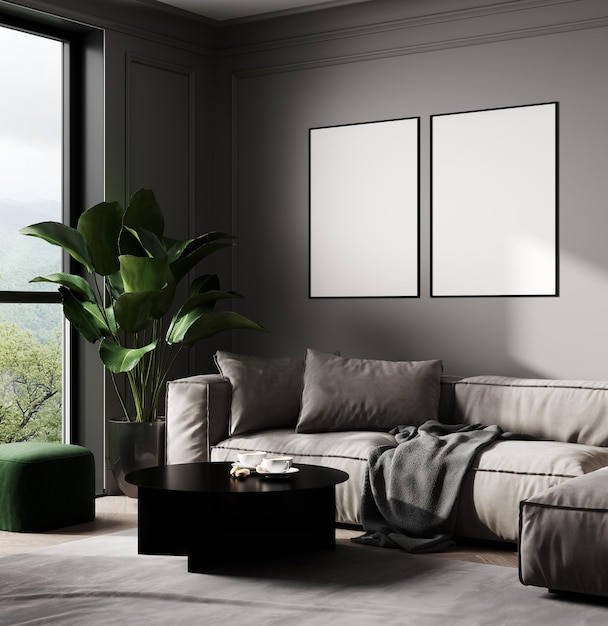 Maquette de deux cadres vierges dans un intérieur de salon moderne avec canapé gris et feuilles tropicales de palmier