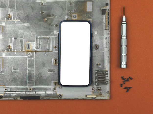 Maquette de téléphone portable pour la société de maintenance de réparation concept de réparation technologique écran blanc vierge vue de dessus photo