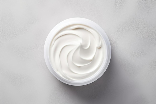 Photo masque cosmétique blanc crémeux baume gel fond gris texturé