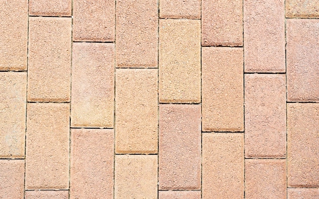 Matériau de texture de carreaux de sol de modèle de brique pour le paysage extérieur. Tuile de clinker en céramique rectangulaire rouge, antique pour patio ou trottoir, texture de tuile vue de dessus