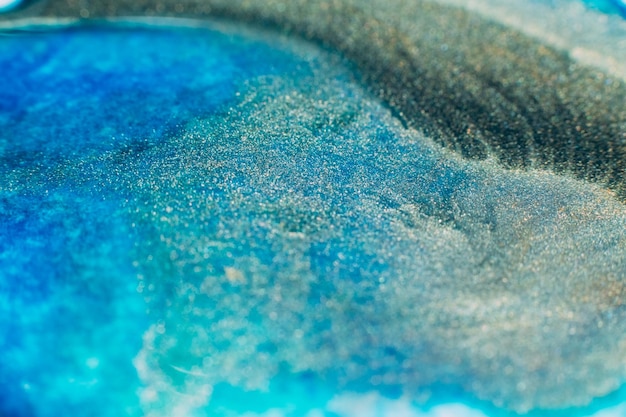 Mélange de peintures Conception de fond abstrait Mélange d'encres bleues
