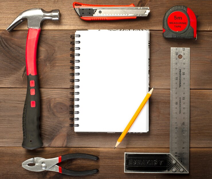 Photo menuiserie divers, outils de réparation, bloc-notes sur bois