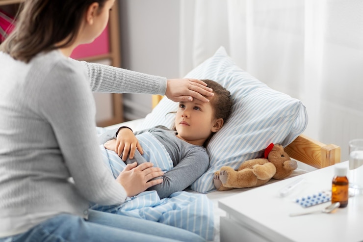 Photo mère mesurant la température de sa fille malade