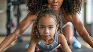 Photo mère et petite fille font de l'exercice dans le stade