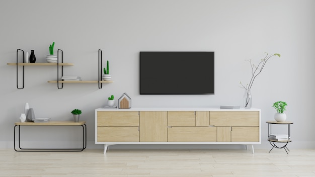 meuble tv bois avec plante sur parquet et mur blanc