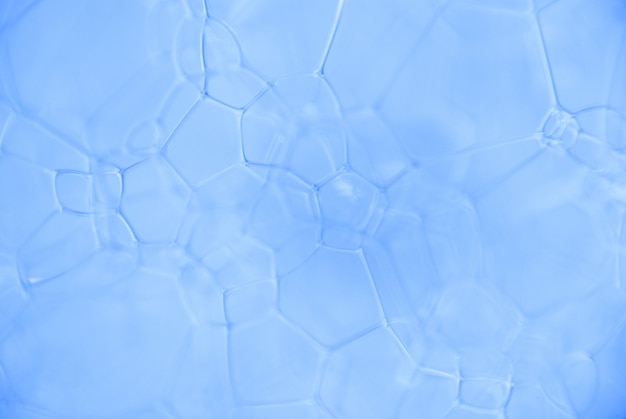 Micrographie du fluide chimique mousseux. La chaîne de composés de fond de microparticules