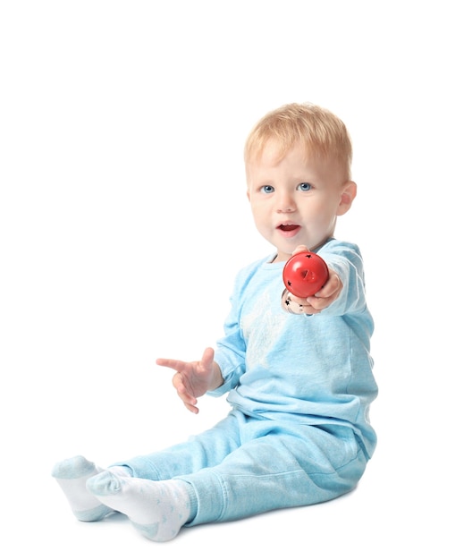 Mignon petit bébé avec jingle bell sur fond blanc. Notion de Noël