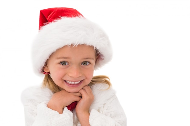 Mignonne petite fille portant le bonnet de Noel