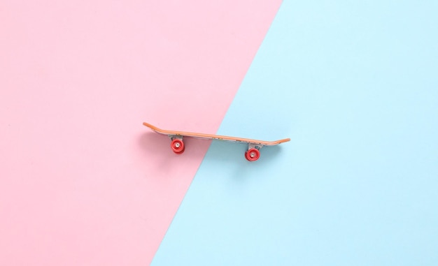 Mini doigt skateboard fond pastel rose bleu