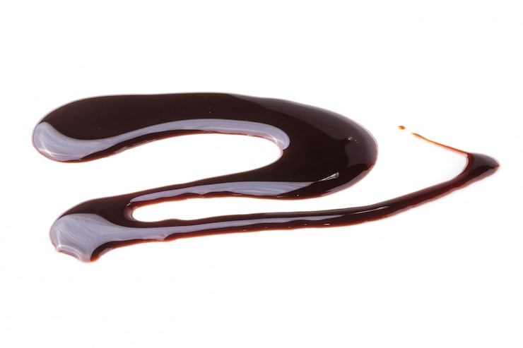 Photo modèle abstrait de sauce au chocolat isolé sur fond blanc