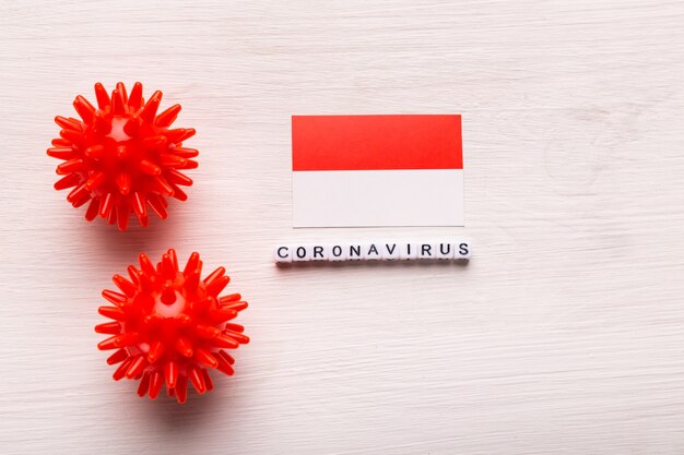 Modèle abstrait de souche de virus du coronavirus du syndrome respiratoire du Moyen-Orient 2019-nCoV ou coronavirus COVID-19 avec texte et drapeau Indonésie sur blanc