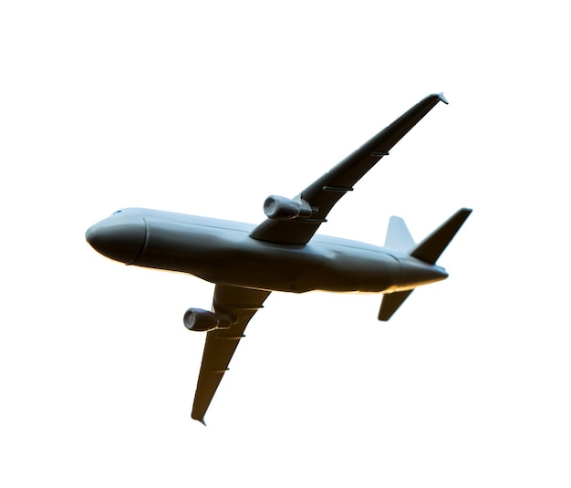 Modèle d'avion à la main sur un ciel ensoleillé Concepts de transport de voyage Transport rêvant de vacances