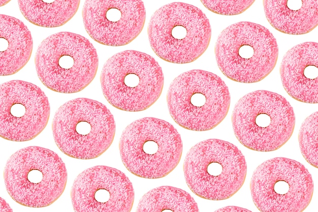 Modèle de beignets décoré de glaçage au chocolat rose et de sucre glace