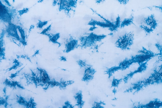 Modèle de colorant bleu sur le tissu de coton, fond de tissu indigo teint et texturé