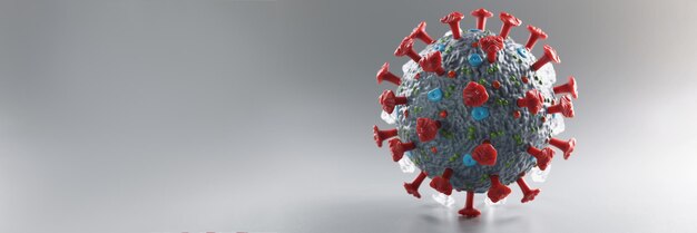 Modèle en plastique de coronavirus sur fond gris