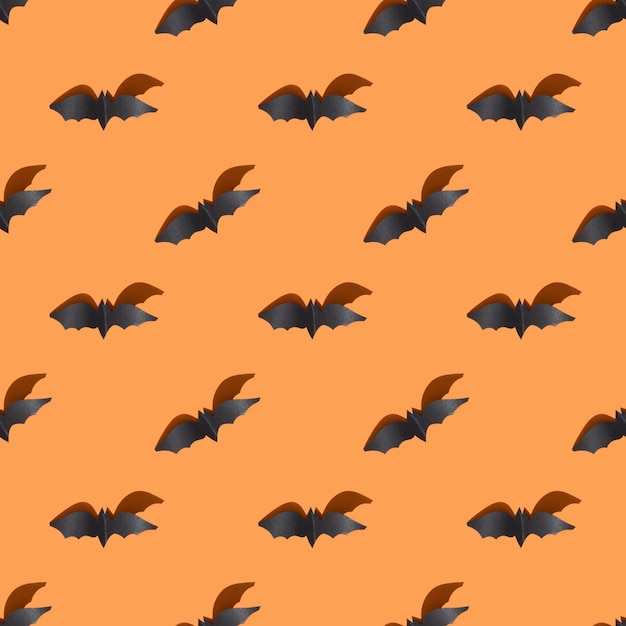 Modèle sans couture Halloween de chauve-souris sur fond orange