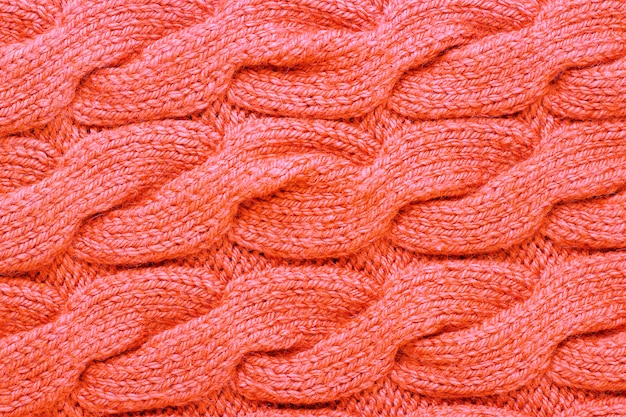 Modèle tricoté tendance couleur vivant corail gros plan, fond, texture