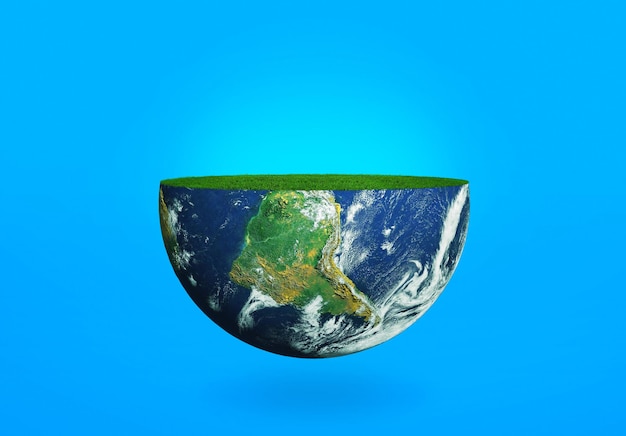Photo la moitié de la planète terre avec de l'herbe sur fond bleu le concept de l'écologie de la planète