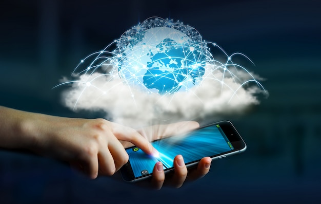 Monde numérique dans un nuage connecté à un téléphone portable de femme d'affaires