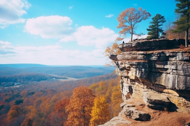 Photo une montagne avec un homme debout sur le bord