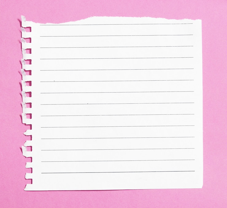 Photo morceaux de papier de cahier déchiré