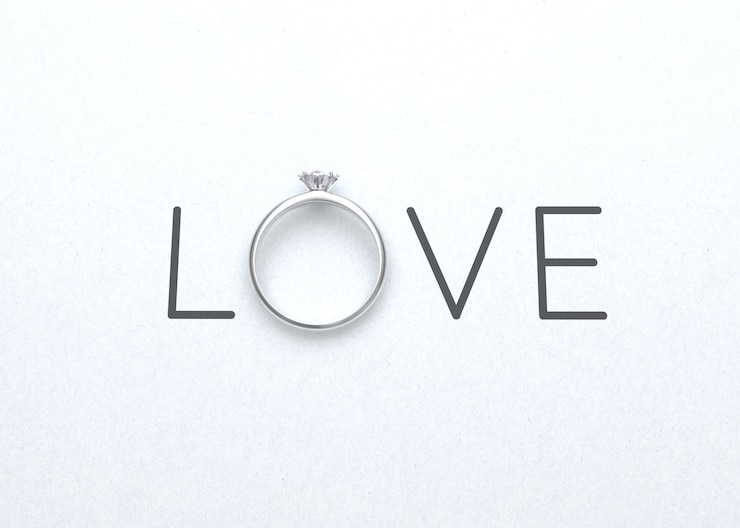 Photo le mot amour avec bague de mariage sur papier blanc pour la saint-valentin fond rendu 3d