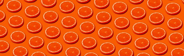 Motif aux agrumes oranges sur fond orange, image panoramique dans un style pop art