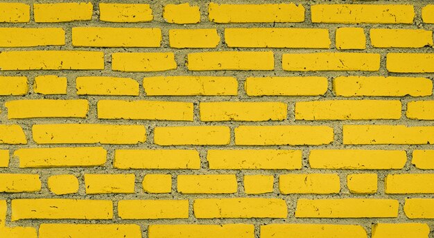Le motif de fond du mur de béton, la texture du panneau de ciment, le jaune avec le blanc en haute résolution et la netteté