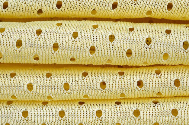 Motif de fond textile de tissu de vêtements de sport à maille jaune