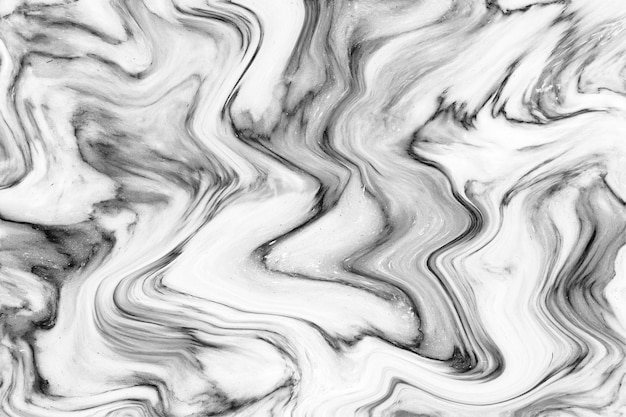 Le motif de fond de texture de vagues peintes à l'acrylique d'encre de marbre gris blanc peut être utilisé pour le papier peint ou le carrelage mural luxueux ou la coque de téléphone portable