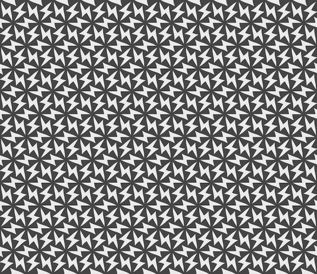 Motif noir et blanc de triangles sur fond gris.