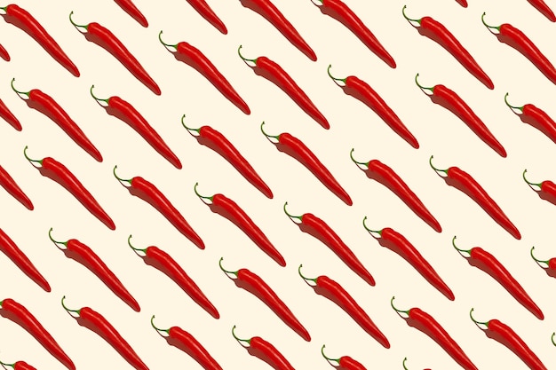 Photo motif de papier de piment sur fond coloré motif d'un piment rouge vue de dessus